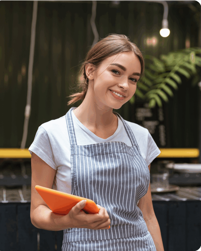 Waitress smiling holding an ipad