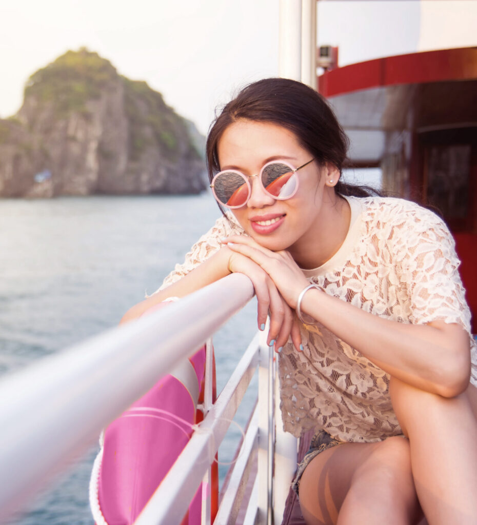 Girl enjoying on a cruiser boat at seaside