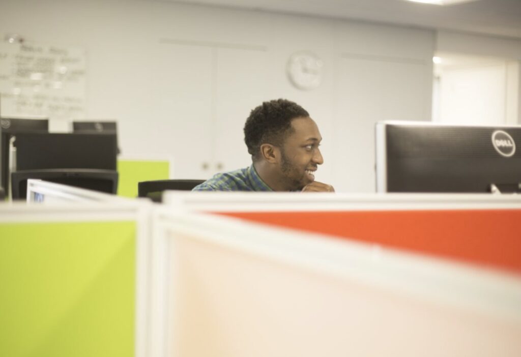 Man smiling at a desk