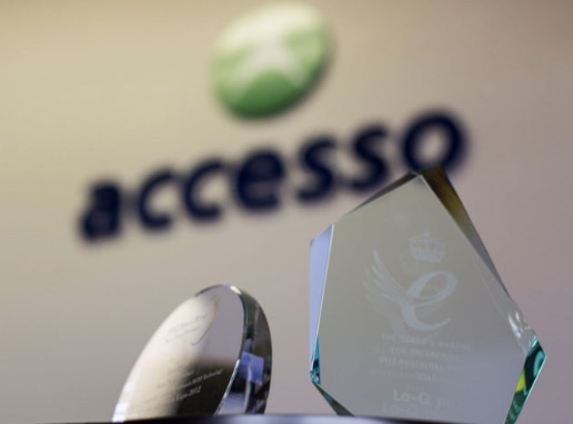 photo of an award in front of accesso logo