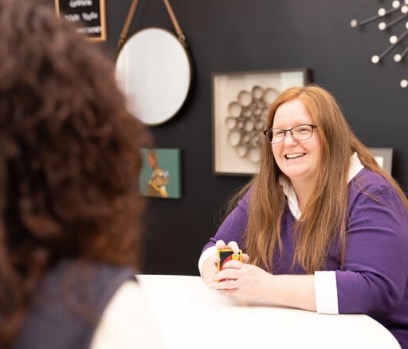 Woman playing cards at a table