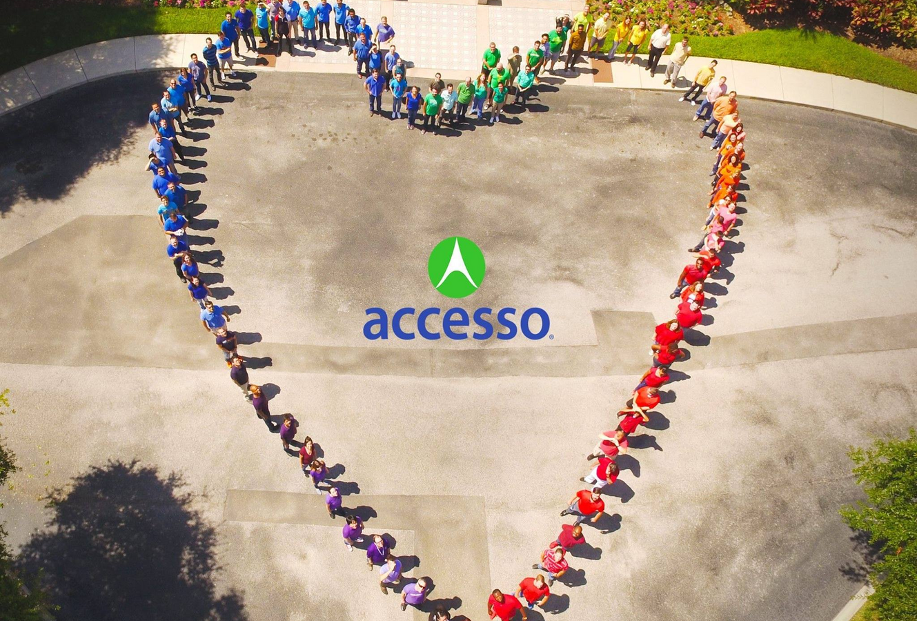 accesso employees standing in shape of a heart