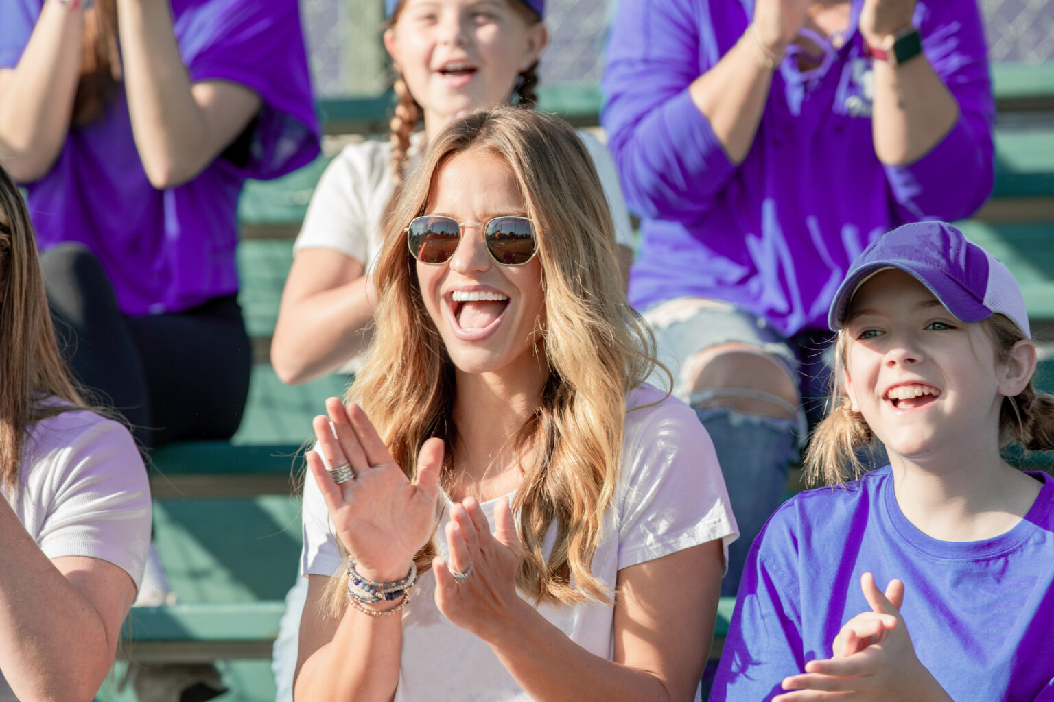 Woman and child cheering at a sporting event