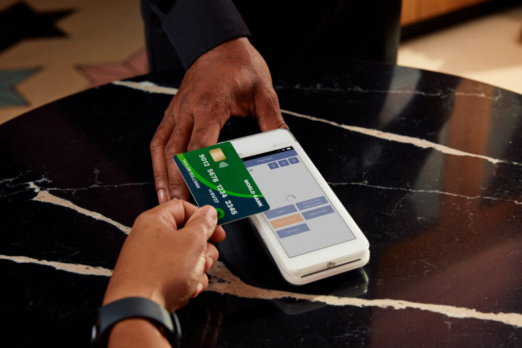 Person tapping card at checkout