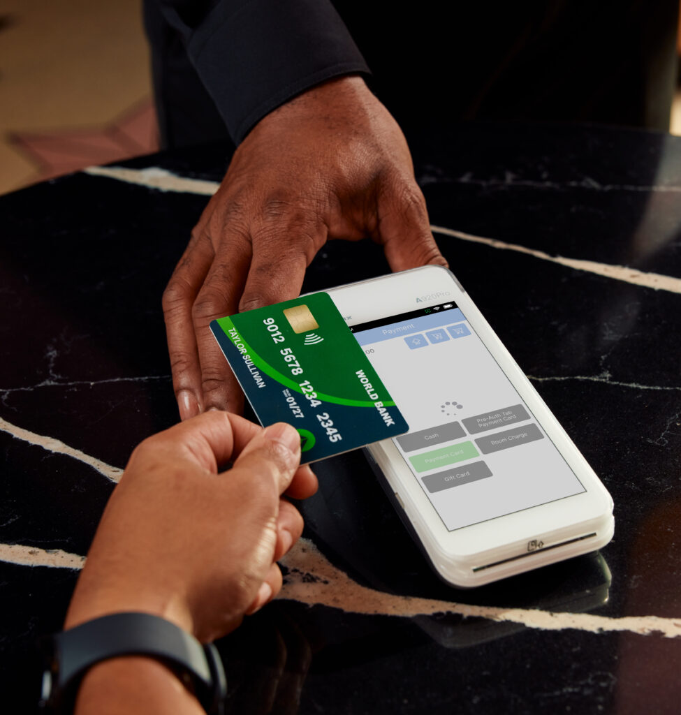 Person tapping their card at checkout