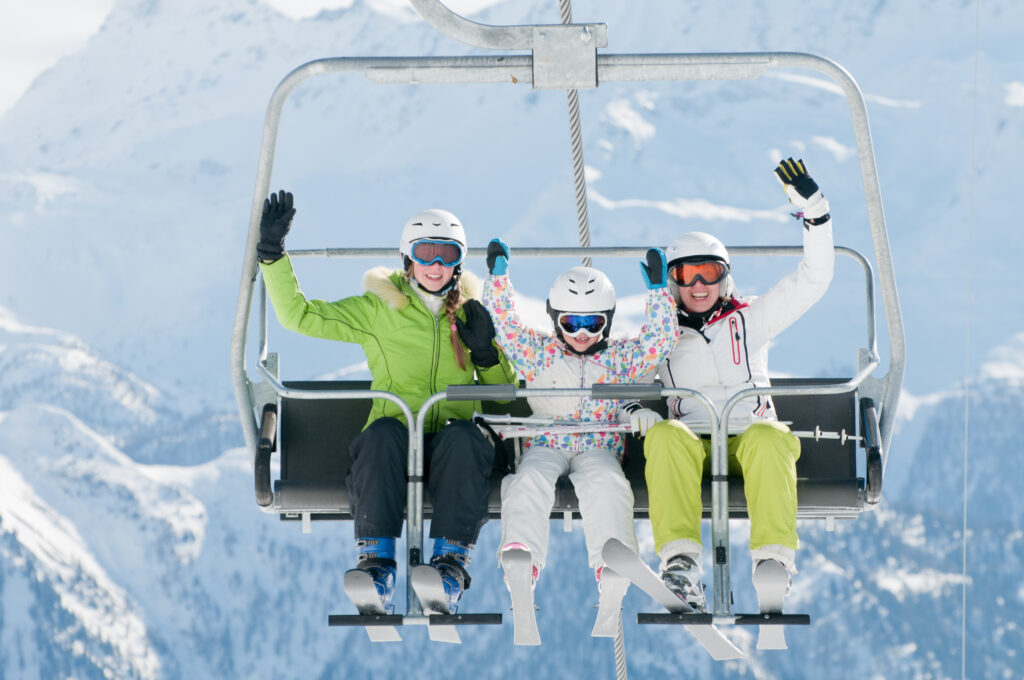 Skiers on a ski lift in the Swiss alps