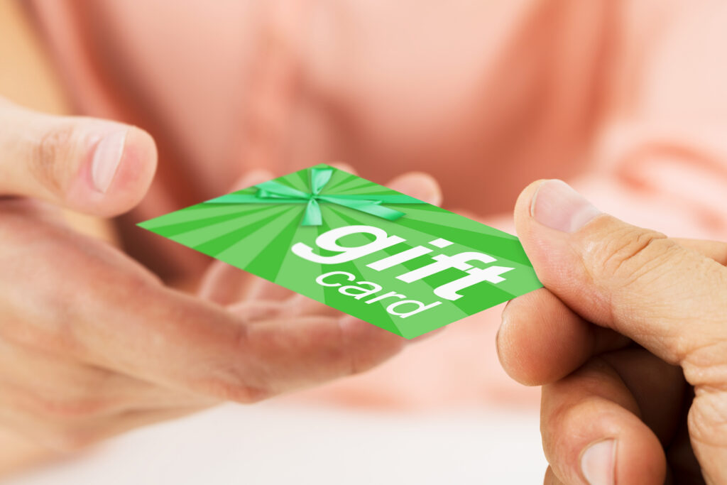 green gift card in hand